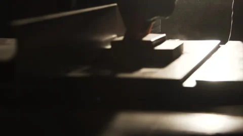 Backlit router table cut with push block and dust in the air Video stock 346255762