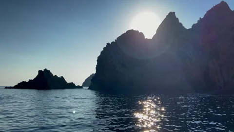 Backlit scandola eroded rock formations, unesco heritage of corsica Stock Footage 277549898