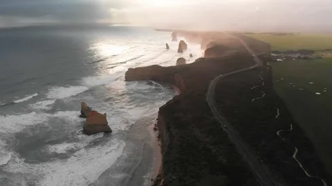 Backlit slow motion aerial view of Twelve Apostles, Port Campbell National Pa Stock Footage 340404466