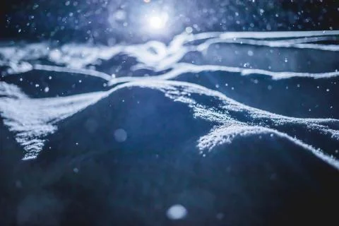 Backlit Snow Texture during Snowstorm at Night Stock-Fotos