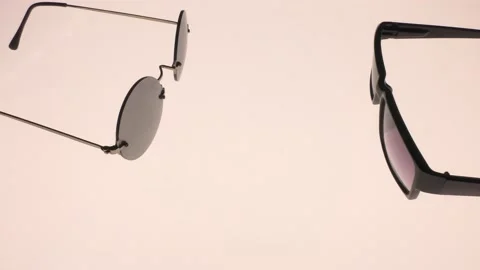Backlit sunglasses. Video camera passage. Stock Footage 138006121