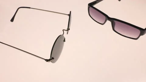 Backlit sunglasses. Video camera passage. Stock Footage 138006156