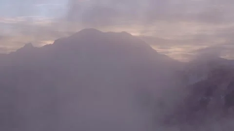 Backlit Sunset Clouds Surrounding Mount Rainier Aerial Washington Видео 332249420