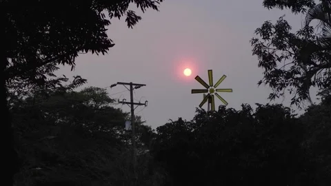 Backlit Sunset with Windmill and Light Pole Video stock 302916818