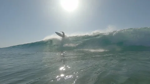 Backlit surfer doing an air 動画素材 127496885