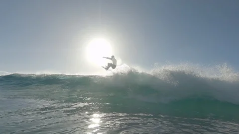 Backlit surfer doing an air 動画素材 127496966