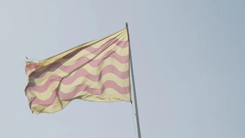 Backlit Tarragona Flag in Slow motion Video stock 119242782