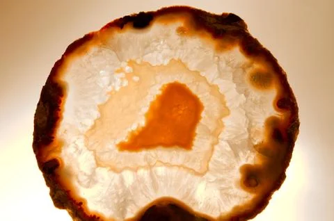 Backlit thin slice of natural agate Stock Photos