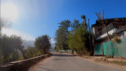 Backlit tracking shot of a road in the Himalayas Stock Footage 123831898