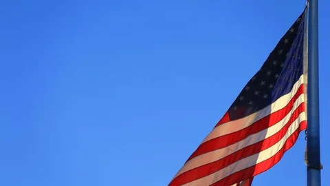 BACKLIT US FLAG CLOSE SUNSET Stock Footage 96561474