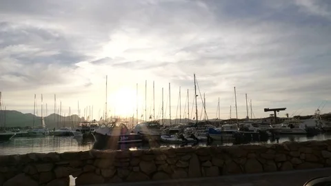 Backlit view of power and sailing boats docked in Porto Rotondo. Stock Footage 79452409