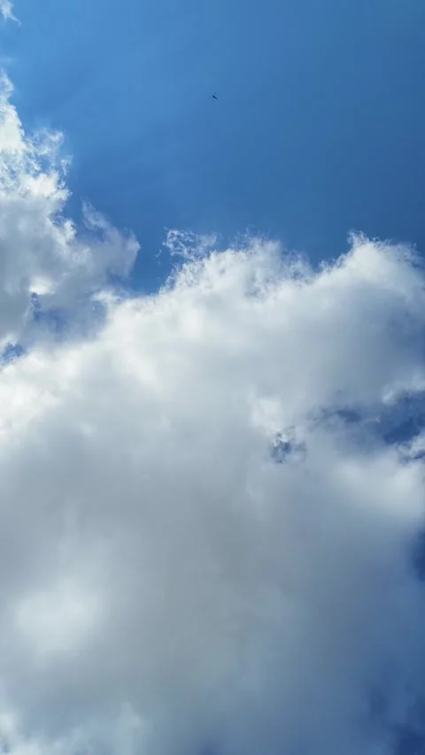 Backlit White Cloud and Deep Blue Sky Background Stock Footage 346786645