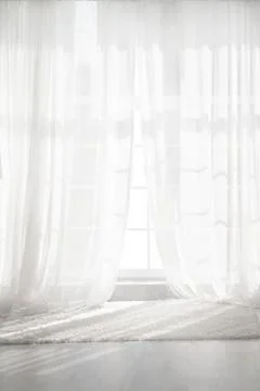 Backlit window with white curtains in empty room Stock Photos