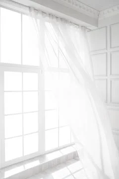 Backlit window with white curtains in empty room Stock Photos