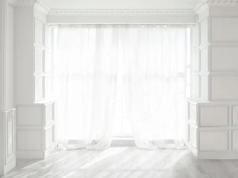 Backlit window with white curtains in empty room Stock Photos