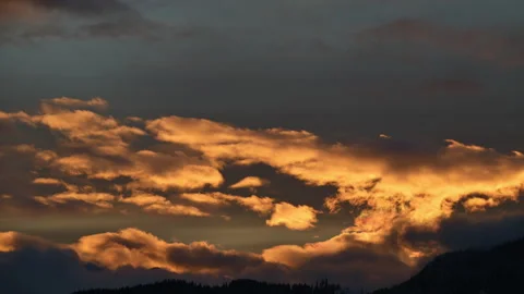 Backlit winter sunset timelapse over mountains, Slovenia, 4K Stock Footage 330782542