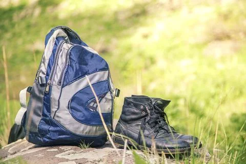 Backpack and shoes Stock Photos