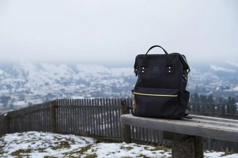Backpack on the background of mountains. Stock Photos