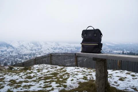 Backpack on the background of mountains. Stock Photos