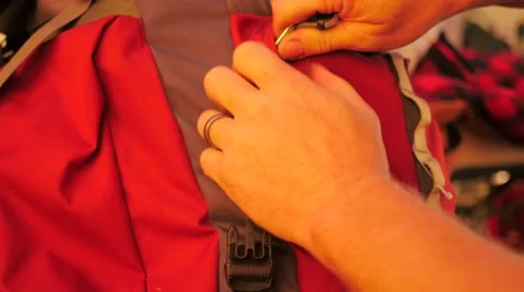 A backpack being opened and closed inside a tent Video stock 68738436