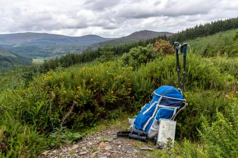 Backpack, binoculars, map and sticks on the mountain, mountain lifestyle in I Stock Photos