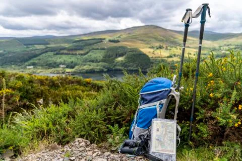Backpack, binoculars, map and sticks on the mountain, mountain lifestyle in I Stock Photos