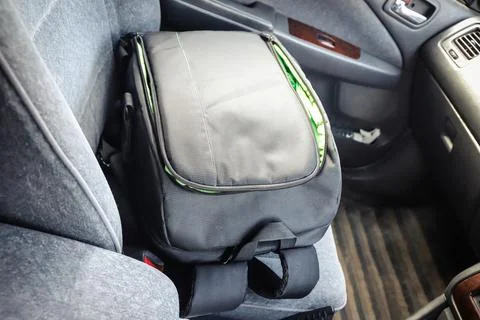 Backpack for the camera on the car seat Stock Photos