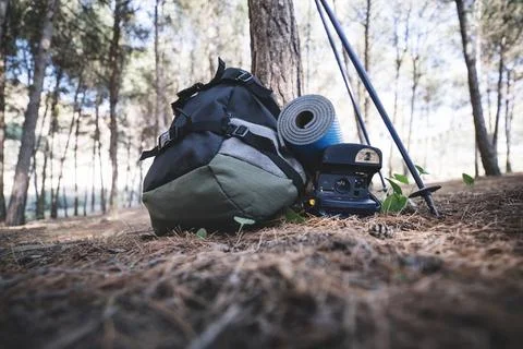 Backpack camera near tree Stock Photos