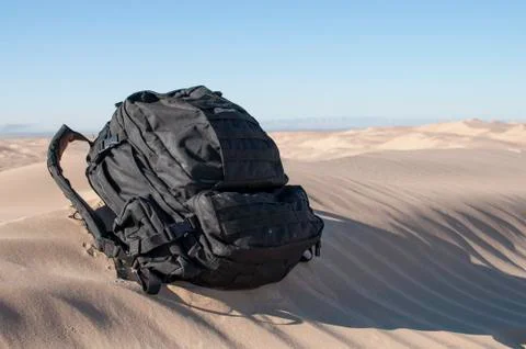 Backpack in desert Stock Photos