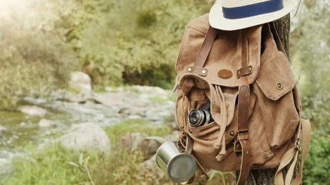 Backpack hanging from a tree. Stock Footage 95197672