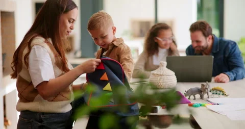 Backpack, help and mom with child in kitchen to prepare for school, morning Stock Footage 336196805