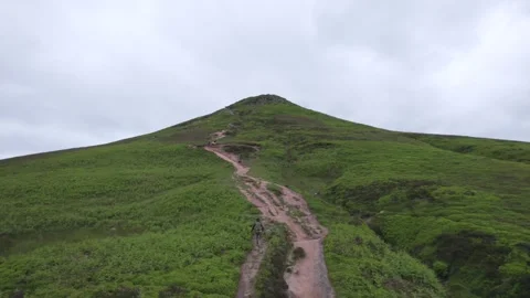 Backpack hiker on the Sugar Loaf, mountain peak, Abergavenny, Monmouthshire.. Video stock 277548335