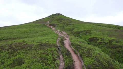 Backpack hiker on the Sugar Loaf, mountain peak, Abergavenny, Monmouthshire.. Video stock 277548447