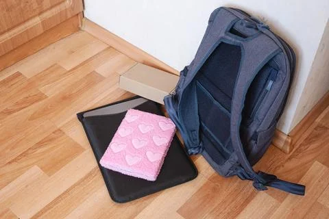 Backpack With Laptop Case And Notebook On Floor 写真素材