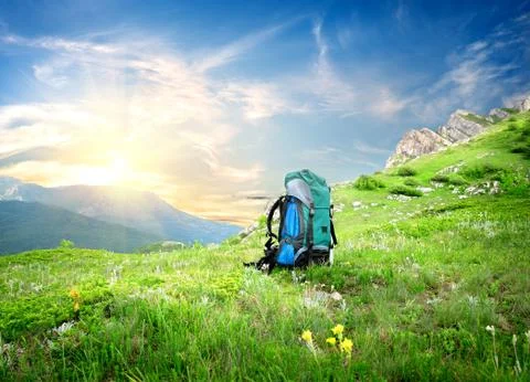 Backpack in mountains Stock Photos