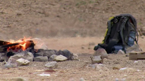 Backpack next to camping bonfire 1. Stock Footage 665173