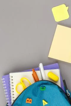 Backpack with notepad and study supplies. 스톡 사진