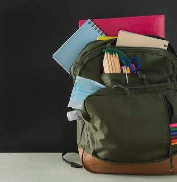 Backpack ready for the return to school. Covid-19 concept. Copy space. Stock Photos