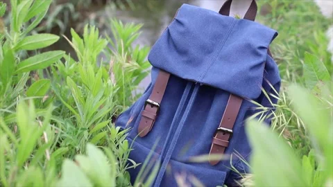 Backpack in a river, backpacker traveler Stock Footage 135730132
