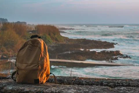 A backpack with a sea landscape on the background Foto stock