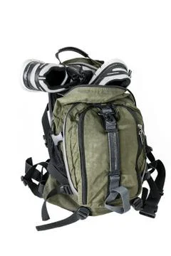 Backpack with sneakers on a white background Stock Photos