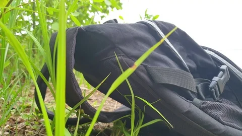 Backpack by the water. Backpack on the beach. Video stock 108543610