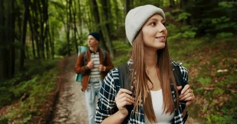 Backpacked Couple Walking in Forest Видео 115284532
