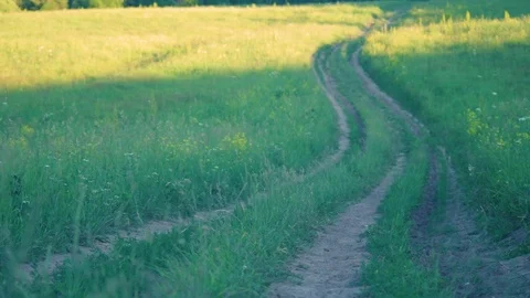 A Backpacker in Blue Baseball Cap, Green Fleece Jacket, Black Pants and Hikin Stock Footage 116534338