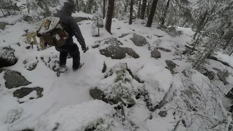 Backpacker climbing up and down on a steep and rocky slope Stock Footage 145953609
