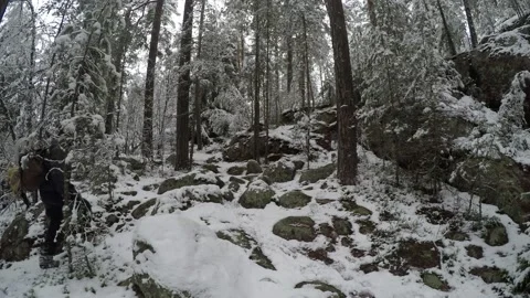 Backpacker climbing steep hill back and forth Stock Footage 145949571