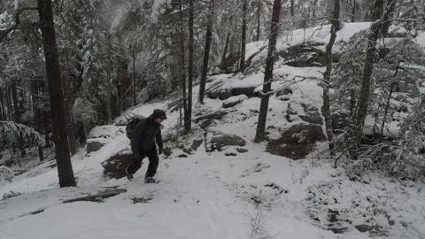 Backpacker climbing on a steep hill Stock Footage 145950588