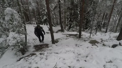 Backpacker climbing towards camera on a steep cliff Stock Footage 145950213