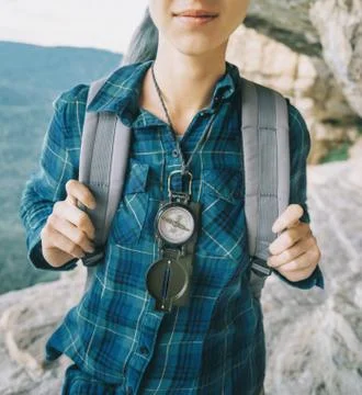 Backpacker with compass. Stock Photos