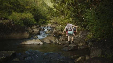 Backpacker Crossing River Stock Footage 75251847